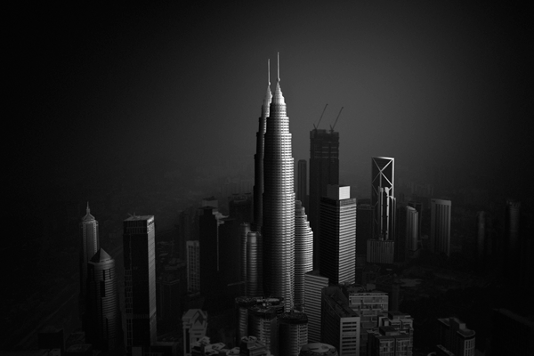 Fine art black and white photograph capturing the Kuala Lumpur cityscape with the iconic Petronas Towers as the focal point